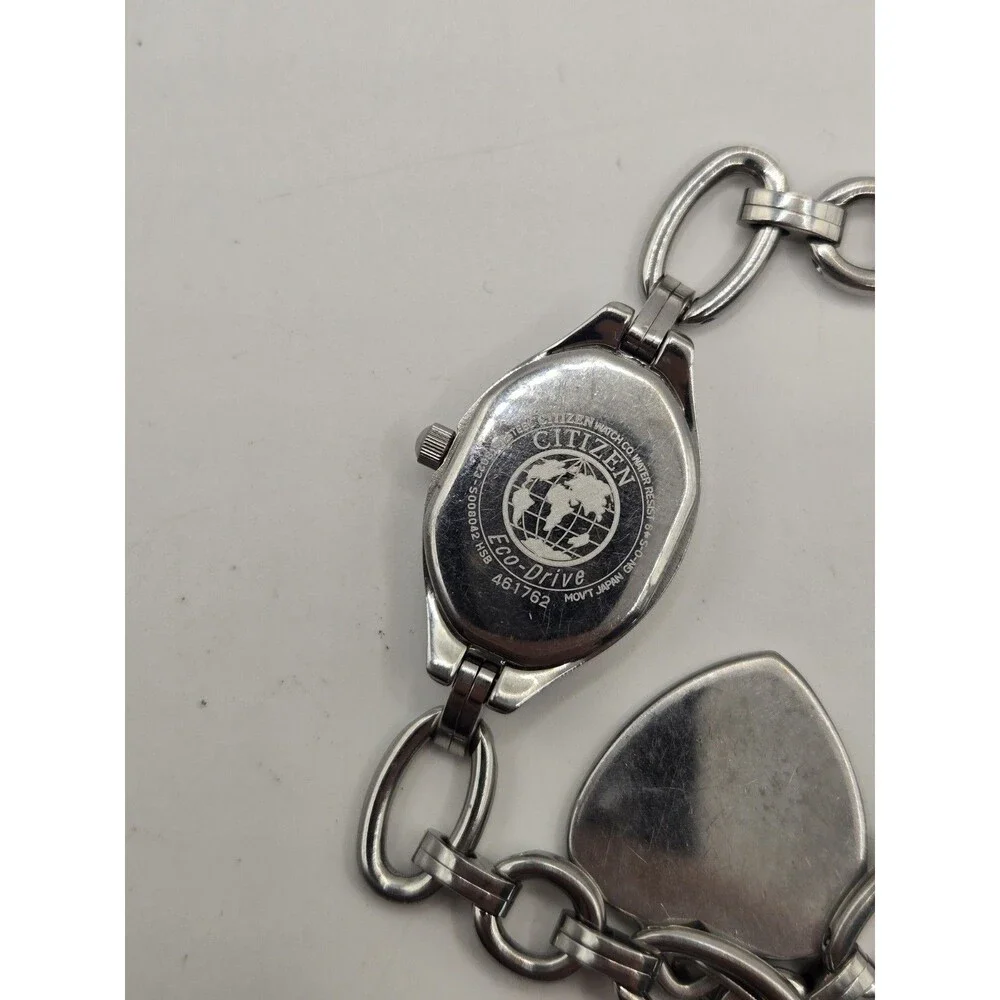 Citizen Eco-Drive Oval Silver Tone White Dial Heart Charm Bracelet Watch.